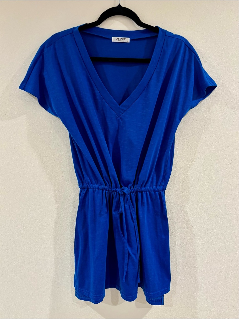 Blue swimsuit cover-up with a cinch waist